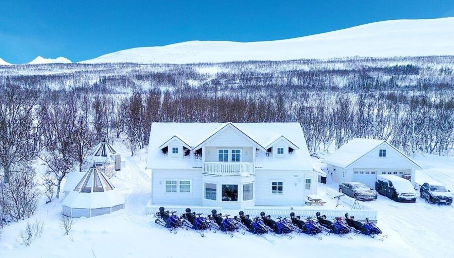 From Tromsø: Lyngen Alps Guided Snowmobile Tour - Getting suited up for the snow