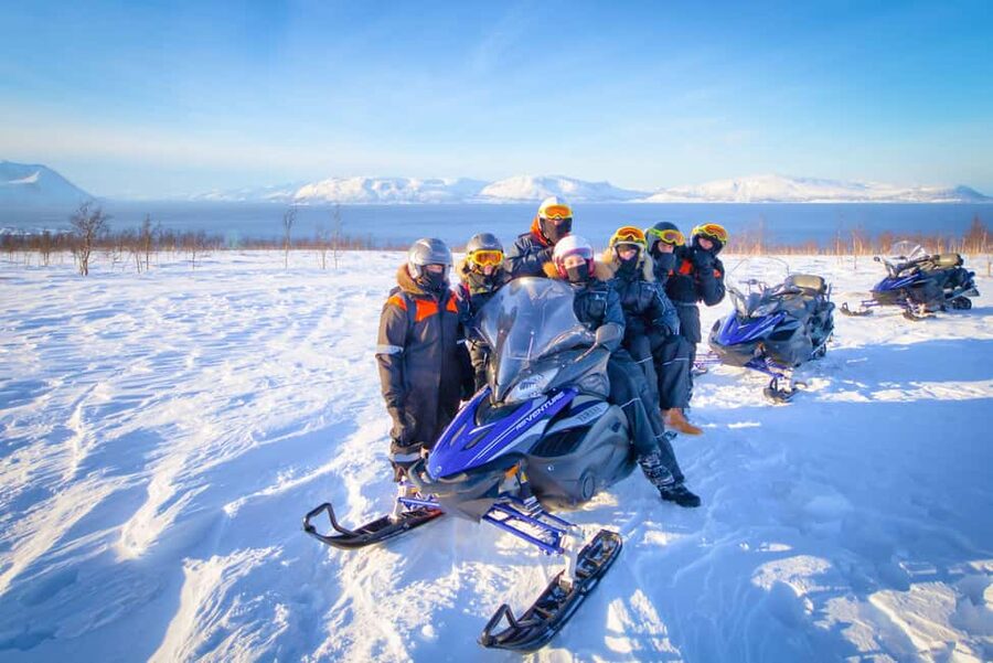 From Tromsø: Lyngen Alps Guided Snowmobile Tour - Sharing a snowmobile and learning the route