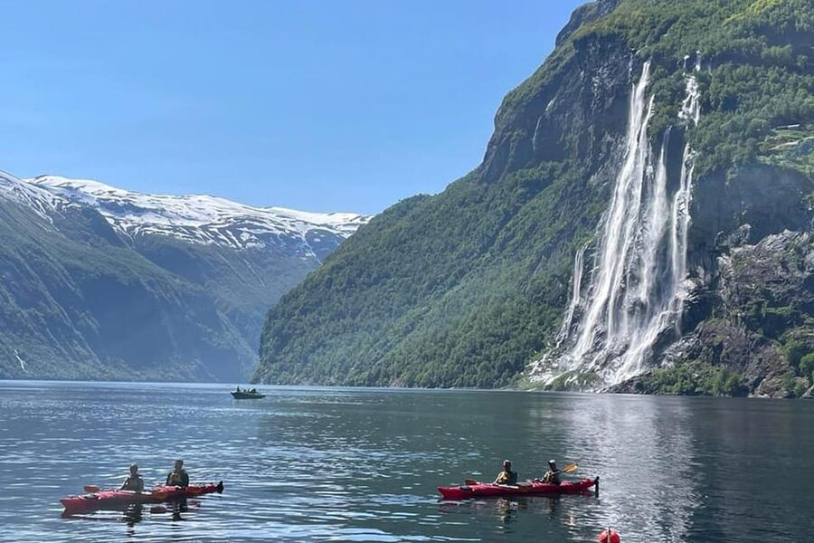 Geiranger Fjord Boat Tour with Waterfall Tasting - Mountain farms, rock faces, and the story of the fjord
