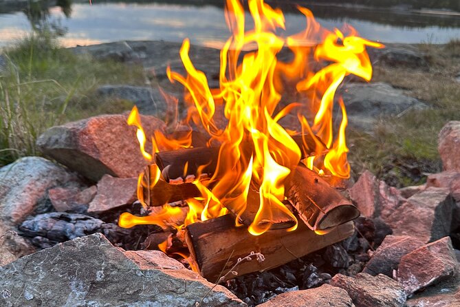 Midnight Sun and Campfire - National Park evening hike Stockholm - The old village and red-painted log houses