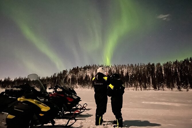 Northern Light snowmobile tour in Kiruna 7:30 pm - Passing the Icehotel by the Torne River