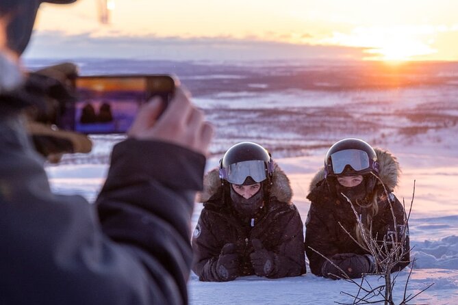 Snowmobile Safari to Lapland viewpoint - A frozen lake, coffee, and a try at ice fishing