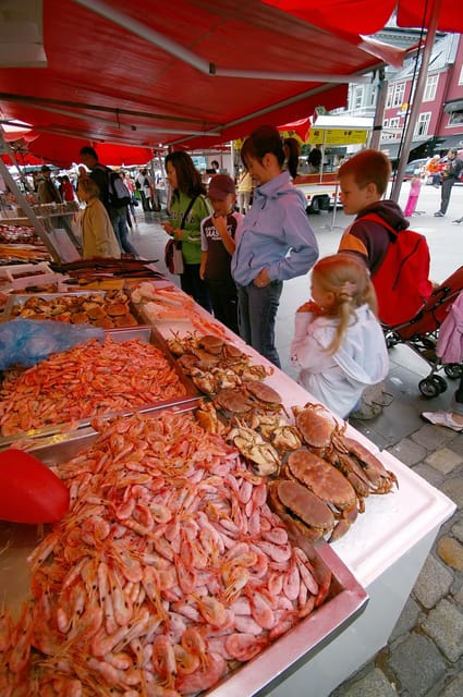 The influence of Bergen in Norways development, city tour - The Fish Market and Bergen’s harbor life