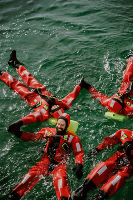 Tromsø city center Urban Floating experience - The rescue suit makes cold water possible